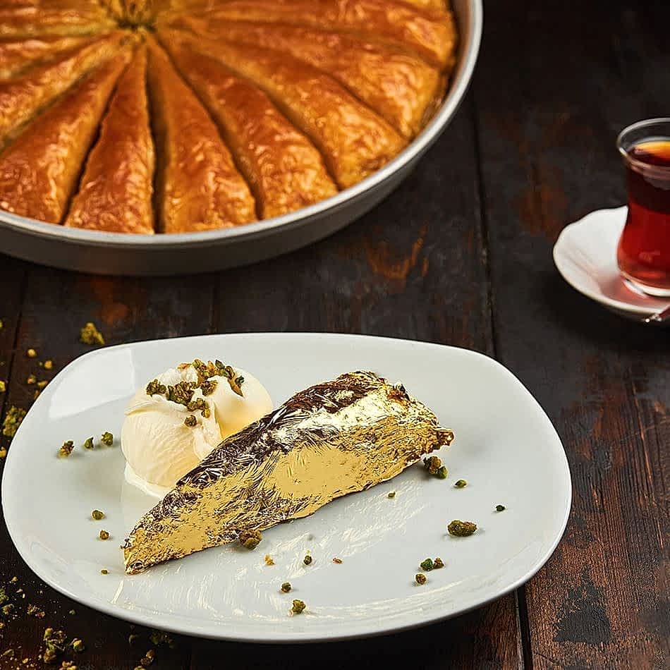 Golden baklava with layers of crisp pastry, served with creamy Maras ice cream.