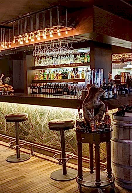 Luxury bar at Nusr-Et Ankara showcasing a wide selection of premium spirits and a stylish, modern ambiance